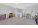 Spacious bonus room featuring neutral paint and carpeted floors at 662 Petal Mist Ln, Brooksville, FL 34604