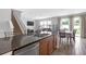 Well-equipped kitchen with stainless steel appliances, breakfast bar seating, and open layout into living areas at 662 Petal Mist Ln, Brooksville, FL 34604