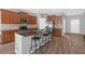 Lovely kitchen with stainless steel appliances, granite countertops, and breakfast bar seating, ideal for Gathering gatherings and entertaining at 662 Petal Mist Ln, Brooksville, FL 34604