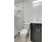 Bathroom featuring a tiled stand up shower with glass door and vanity at 6703 N Boulevard, Tampa, FL 33604