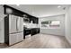 Modern kitchen with stainless steel appliances, and sleek, dark cabinetry at 6703 N Boulevard, Tampa, FL 33604