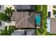Aerial view of the roof, pool, and patio of a lovely home in a well manicured neighborhood at 7029 Dowling Mill Cir, Tampa, FL 33625