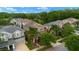 Aerial view of home showcasing mature trees, a brown roof and well-maintained lawns at 7029 Dowling Mill Cir, Tampa, FL 33625