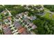 Aerial view of homes nestled near a pond, showcasing lush trees and well-maintained landscapes at 7029 Dowling Mill Cir, Tampa, FL 33625