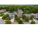 Charming homes with well-manicured lawns are located on a cul-de-sac surrounded by mature trees, creating a picturesque neighborhood at 7029 Dowling Mill Cir, Tampa, FL 33625