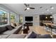 Open-concept living room with large sectional and breakfast bar area at 7029 Dowling Mill Cir, Tampa, FL 33625