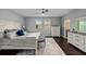 Bright main bedroom boasts an area rug, ceiling fan and en suite bathroom access at 7029 Dowling Mill Cir, Tampa, FL 33625