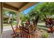 Inviting front porch features a brick floor and relaxing rocking chairs at 7029 Dowling Mill Cir, Tampa, FL 33625