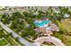 Aerial view of a community featuring a pool, playground, common areas, and well-maintained landscaping at 7511 Turtle View Dr, Ruskin, FL 33573