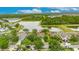 Scenic aerial view of home situated in a charming community near a tranquil lake, surrounded by lush greenery at 7511 Turtle View Dr, Ruskin, FL 33573