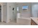 Bathroom featuring a glass shower, bathtub and tile flooring at 7511 Turtle View Dr, Ruskin, FL 33573