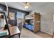 Comfortable bedroom with built-in bunk beds, wooden desk and chair, great for studying and sleeping at 7511 Turtle View Dr, Ruskin, FL 33573