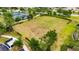 Aerial view of a large grassy common area bordered by landscaping and a walking path, great for outdoor activities at 7511 Turtle View Dr, Ruskin, FL 33573
