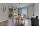 Inviting dining room with sliding door, view, modern chandelier, and stylish wood floors at 7511 Turtle View Dr, Ruskin, FL 33573