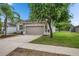 Charming single-story home featuring a two-car garage and beautifully landscaped front yard at 7511 Turtle View Dr, Ruskin, FL 33573
