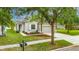 Charming single-story home featuring a two-car garage and beautifully landscaped front yard at 7511 Turtle View Dr, Ruskin, FL 33573