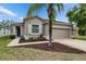 Charming single-story home featuring a two-car garage and beautifully landscaped front yard at 7511 Turtle View Dr, Ruskin, FL 33573