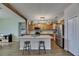 Spacious kitchen with a marble island, wood cabinets, and stainless steel appliances at 7511 Turtle View Dr, Ruskin, FL 33573