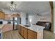 Open kitchen with large island, stainless steel appliances and view of the living room at 7511 Turtle View Dr, Ruskin, FL 33573