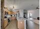 Spacious kitchen open to the living area, featuring a large island and stainless steel appliances at 7511 Turtle View Dr, Ruskin, FL 33573