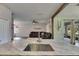 Kitchen island with stainless steel sink overlooks the living room at 7511 Turtle View Dr, Ruskin, FL 33573