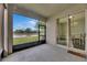 Spacious lanai area with serene water views, easily accessible from the dining area through sliding glass doors at 7511 Turtle View Dr, Ruskin, FL 33573