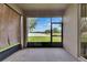 Enclosed lanai with pull down shades, providing views of the nearby lake and relaxing outdoor space at 7511 Turtle View Dr, Ruskin, FL 33573