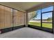 Relaxing screened lanai with roll-down shades and beautiful water view, perfect for enjoying the outdoors at 7511 Turtle View Dr, Ruskin, FL 33573