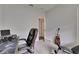 Home office with desk, chair, and guitar, offering a functional workspace at 7511 Turtle View Dr, Ruskin, FL 33573