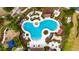 Aerial shot showcasing a community pool, playground, and manicured landscaping, perfect for families and relaxation at 7511 Turtle View Dr, Ruskin, FL 33573