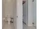 Compact toilet room featuring patterned tile flooring, toilet and a trash can at 7511 Turtle View Dr, Ruskin, FL 33573