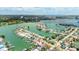 Stunning aerial view showcasing waterfront homes, private docks, and vibrant city skyline in the distance at 7889 3Rd S Ave, St Petersburg, FL 33707