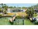 Picturesque waterfront home with a dock, patio, and an expansive backyard perfect for outdoor activities at 7889 3Rd S Ave, St Petersburg, FL 33707