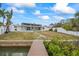 Backyard view showcasing the patio and waterfront access with dock, offering a relaxing outdoor experience at 7889 3Rd S Ave, St Petersburg, FL 33707