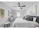 Bright bedroom with a comfortable bed, stylish artwork, and a window with natural light at 7889 3Rd S Ave, St Petersburg, FL 33707