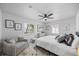 Comfortable bedroom with a soft bed, stylish accents, and plenty of natural light from the windows at 7889 3Rd S Ave, St Petersburg, FL 33707