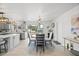 Charming dining area with a modern round table, stylish chairs, and unique light fixture at 7889 3Rd S Ave, St Petersburg, FL 33707