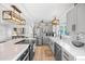 Stylish kitchen featuring stainless steel appliances, white countertops, and gray cabinetry at 7889 3Rd S Ave, St Petersburg, FL 33707