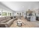 A spacious living area with lots of natural light and an open layout that leads into the modern kitchen at 7889 3Rd S Ave, St Petersburg, FL 33707