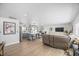 Bright open-concept living space with modern finishes and plank flooring throughout at 7889 3Rd S Ave, St Petersburg, FL 33707