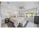 Spacious main bedroom featuring large windows, ample lighting and neutral-colored decor at 7889 3Rd S Ave, St Petersburg, FL 33707