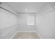 Spacious walk-in closet with ample shelving for organized storage solutions at 7889 3Rd S Ave, St Petersburg, FL 33707