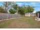 Fenced backyard with a storage shed offers privacy at 8141 82Nd Ave, Seminole, FL 33777