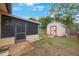 This backyard boasts a shed and a screened-in patio, perfect for outdoor relaxation and storage at 8141 82Nd Ave, Seminole, FL 33777