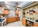 Functional kitchen featuring tile floors, wood cabinets, and ample countertop space for meal preparation at 8141 82Nd Ave, Seminole, FL 33777