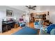 Inviting living room featuring hardwood floors, comfortable seating, and views into the dining area at 8141 82Nd Ave, Seminole, FL 33777
