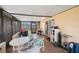 The sunroom has tiled floors and an outdoor view. The seating arrangement includes a table and four chairs at 8141 82Nd Ave, Seminole, FL 33777