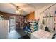 Picture of storage area with ceiling fan, shelving units, refrigerator, washer and dryer at 8141 82Nd Ave, Seminole, FL 33777