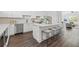 Bright kitchen features white cabinets, stainless steel appliances, and a breakfast bar with seating at 883 6Th S Ave, St Petersburg, FL 33701