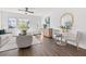 Bright living area with modern décor, neutral furniture, hardwood floors and a ceiling fan at 883 6Th S Ave, St Petersburg, FL 33701